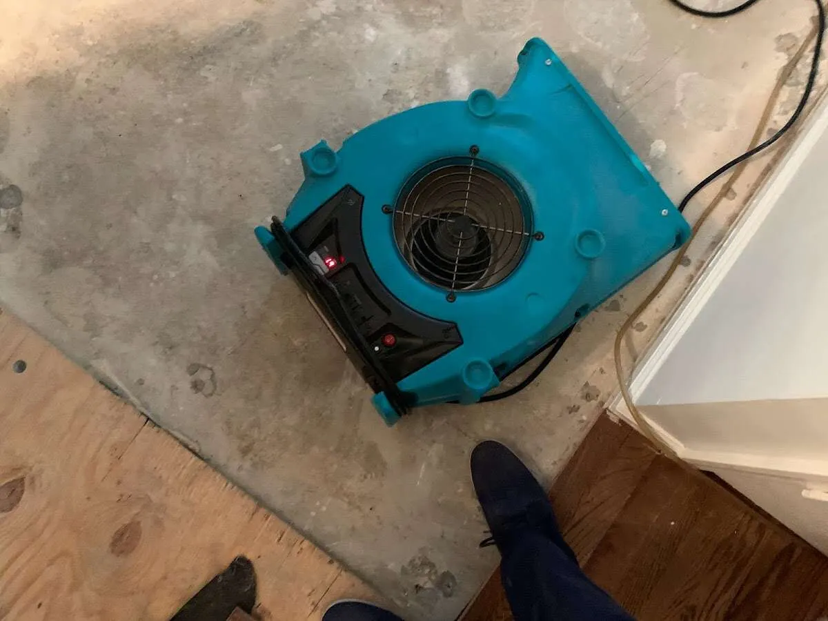 Air mover drying subfloor during Leak Detection & Repair in Clarkstown